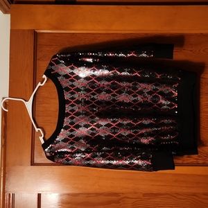 Sequined dress shirt with elbow length sleeves, gently worn.